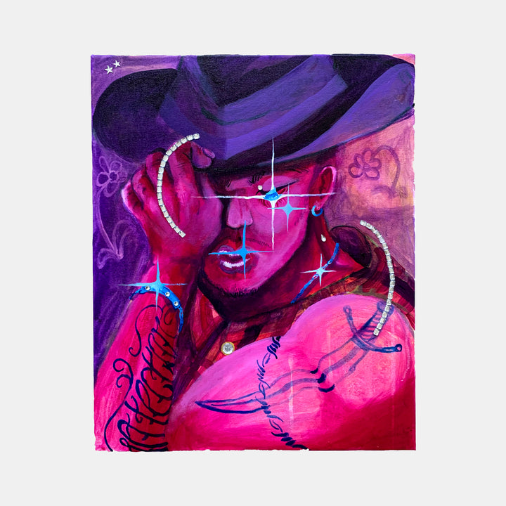 The artwork 'Caballero' by Juan Arango Palacios features a vibrant portrait in pink and purple hues, adorned with sparkling rhinestones creating curved accents. The composition showcases bold brushstrokes in acrylic paint, with swirling decorative patterns and dynamic blue highlights creating a dramatic contrast against the magenta background. The figure wears a wide-brimmed hat and appears in a contemporary pop art style.