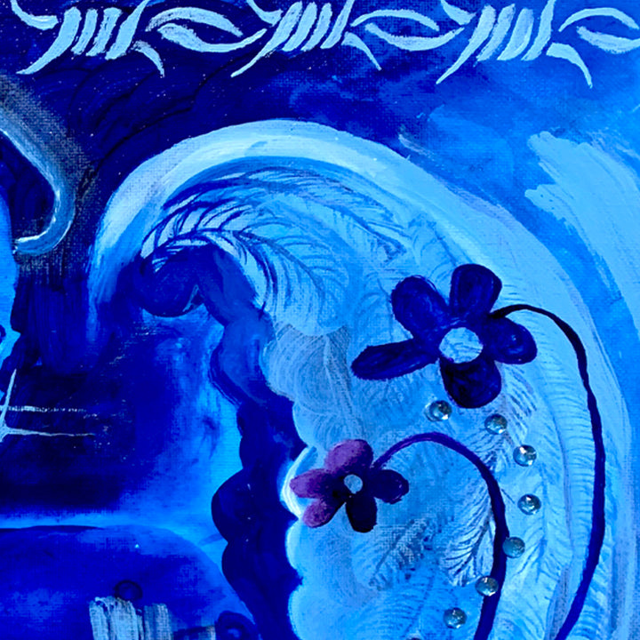 The artwork 'Mi Dulce Compañía' by Juan Arango Palacios features vibrant electric blue swirls and waves creating a dynamic oceanic pattern. Dark purple flowers with rhinestone centers float against the swirling background. The composition combines bold brushstrokes with delicate floral elements in acrylic, enhanced by sparkling rhinestone embellishments on canvas. The top border displays a rhythmic blue pattern resembling barbed wire or tribal mo