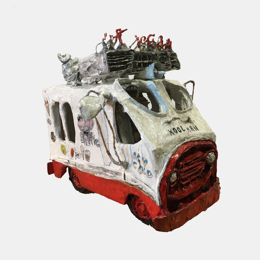 The artwork 'Killing me Softie' by Andrew Chan features a whimsical paper mache ice cream truck sculpture in white, red, and grey tones. The weathered vehicle displays distressed textures and graffiti-like markings, with tiny red figures perched atop its roof. The sculptural piece combines urban art aesthetics with nostalgic ice cream truck imagery, measuring 18x11x24 inches.