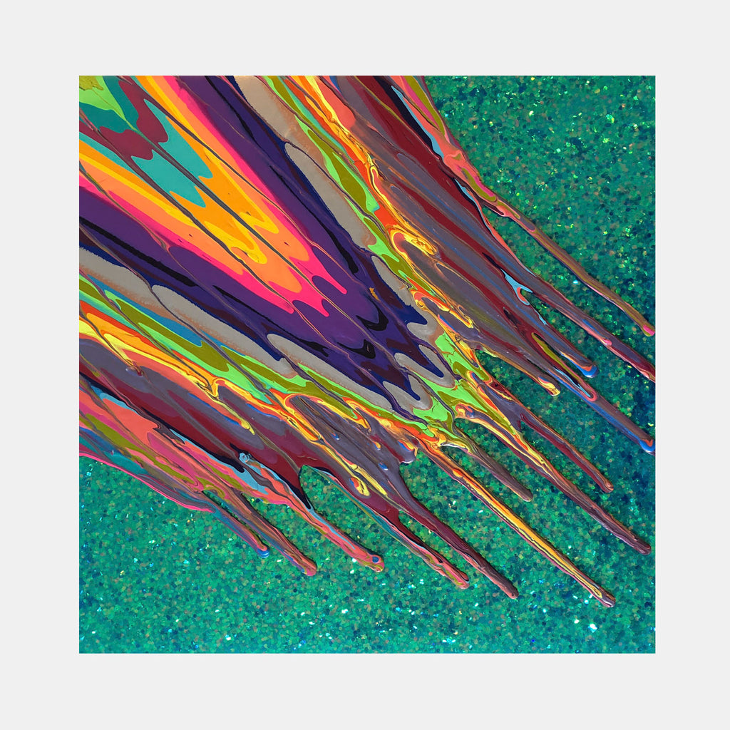 The artwork 'Kinetic e-Mini Collection XXIX' by Paola Gracey features dynamic diagonal streaks of vibrant colors including purple, orange, yellow, and turquoise against a sparkling emerald green background. The abstract composition shows fluid paint strokes with a glossy resin finish, creating movement and depth through layered acrylic and glitter elements.