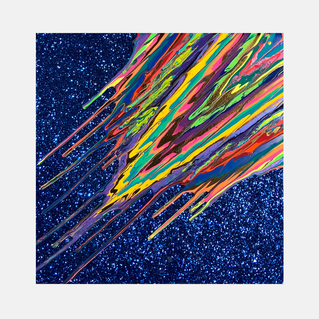The artwork 'Kinetic e-Mini Collection XXXVII' by Paola Gracey features dynamic diagonal streaks of vibrant colors including pink, yellow, green, and orange against a deep blue glittering background. The abstract composition resembles meteors or comets streaking across a starlit sky, created with acrylic paint, glitter, and epoxy resin on a 16x16 inch panel.