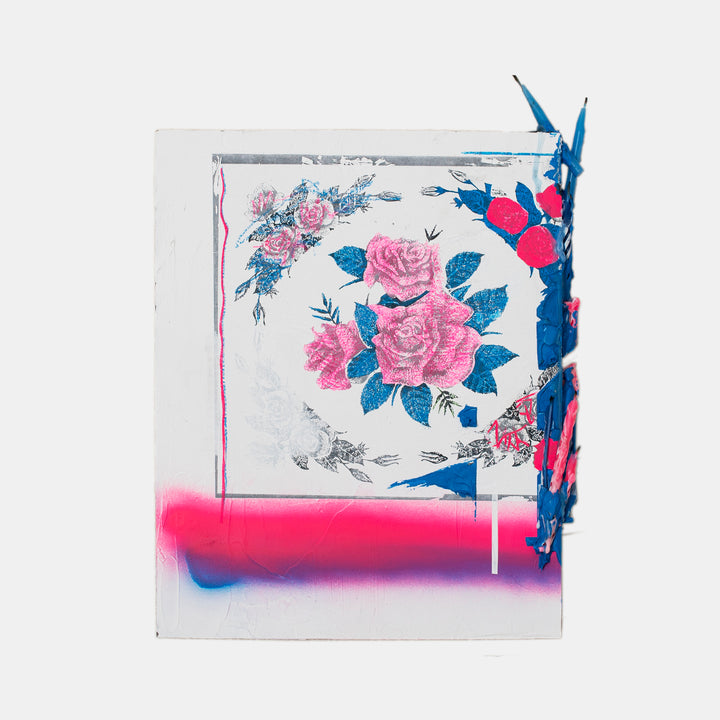 The artwork 'Letter iii' by Troy Medinis features a vintage floral pattern transfer with pink roses and blue leaves, enhanced with vibrant spray paint accents in hot pink and electric blue. The mixed media piece combines gesso transfer technique with textural molding paste and birthday candles, creating a contemporary interpretation of traditional floral motifs.