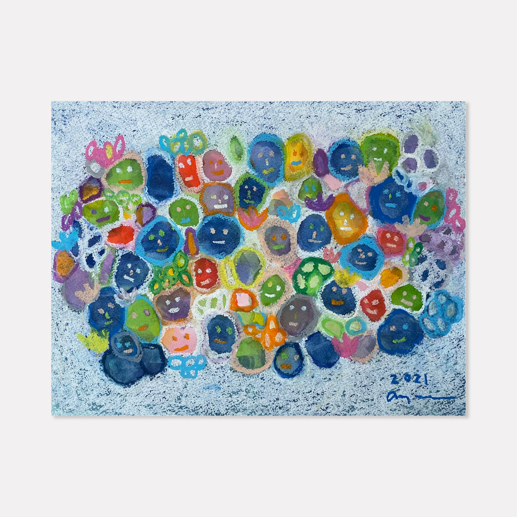 Living in a Community by Ayane Kurai features vibrant watercolor and cray-pas circles in blue, green, pink, and orange arranged in a cluster against a textured light blue background. The playful, bubble-like shapes create an abstract pattern suggesting connection and togetherness, painted with loose, expressive brushstrokes.