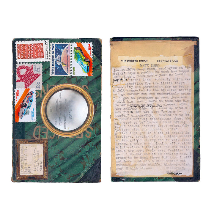 Bus to Chinatown by Mitsuko Brooks: Mixed media mail art featuring vintage postage stamps, circular mirror element on dark green textured book cover, alongside typewritten text on aged paper. Collage incorporates colorful stamps showing geometric patterns and transportation themes, arranged on repurposed book materials.