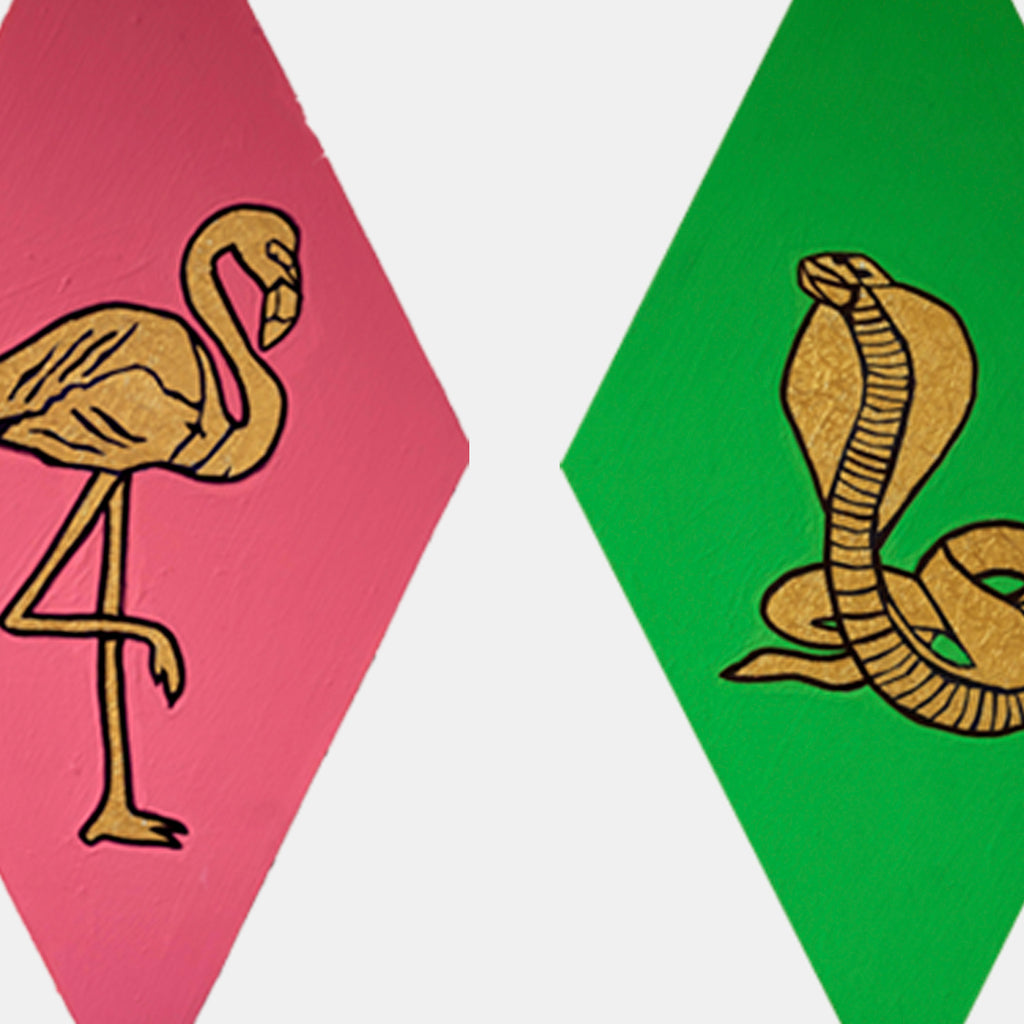 The artwork 'Rooster, Pitbull, Flamingo, Snake' by Marco DaSilva features hexagonal panels with bold animal silhouettes. Two panels shown: a golden flamingo against pink background and a coiled cobra snake against green background. Created using latex paint with metallic gold accents, marker details, and tinfoil embellishments on wooden surfaces.