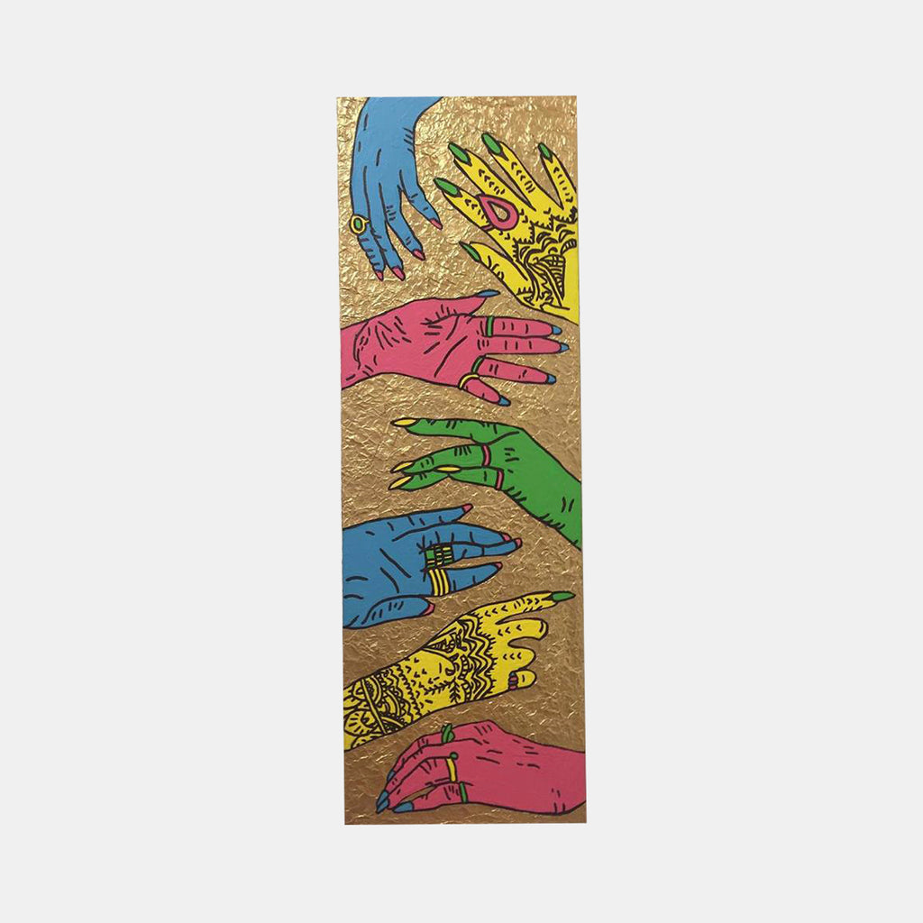 The artwork 'Rihanna's Hands' by Marco DaSilva features vibrant pop art-style hands in blue, pink, yellow, and green against a metallic gold background. The elongated canvas displays overlapping hands with intricate marker details and patterns, combining latex paint and tinfoil textures for a striking contemporary mixed-media effect.