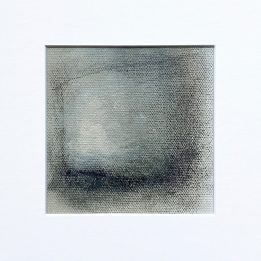 The artwork 'MOMENTUM III' by Xanthippe Tsalimi features a minimalist abstract composition on canvas, showcasing a gradual transition from light gray at the center to darker charcoal tones at the edges, creating a subtle atmospheric depth through textured brushwork. The 8x8 inch oil painting demonstrates a misty, ethereal quality with a distinctive textured surface.