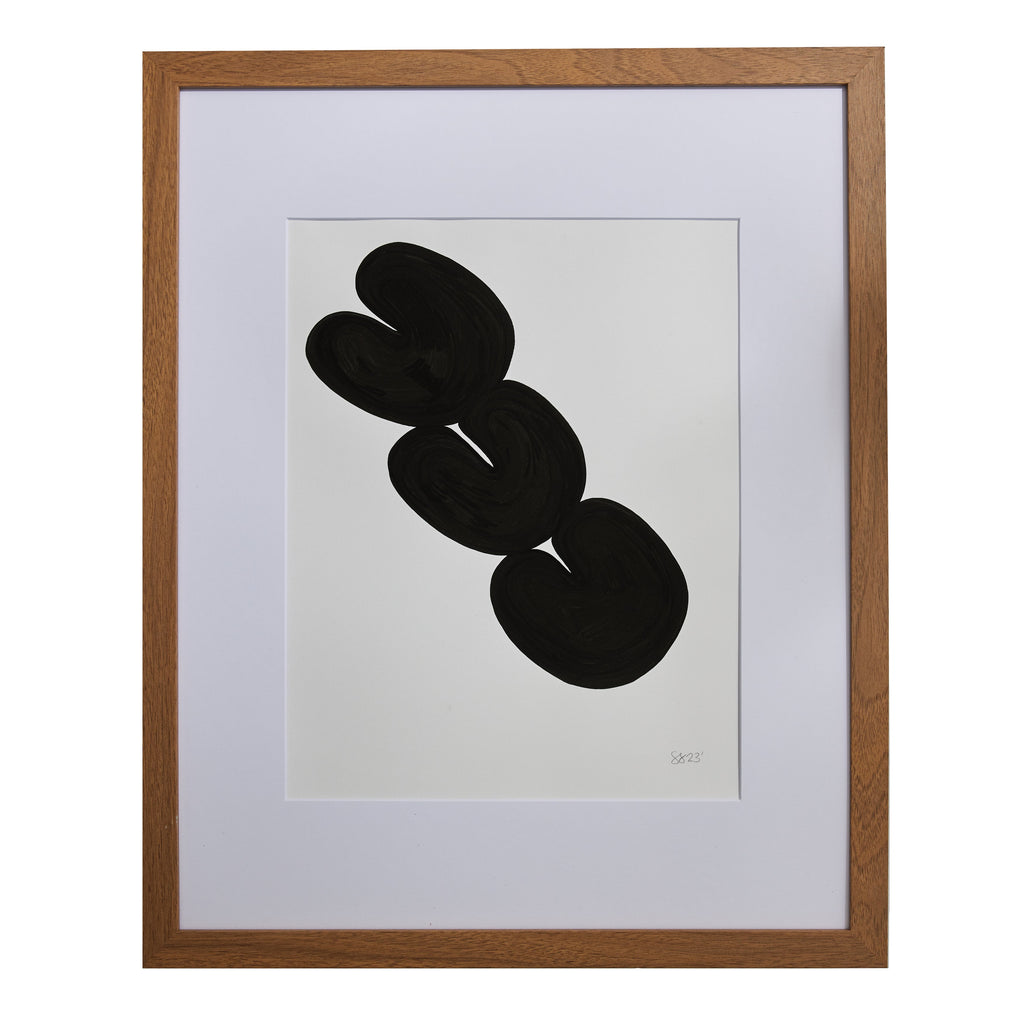 The artwork 'Morning Meditation IV' by Shadia Sabagh features bold black organic shapes on white paper, displaying three interconnected abstract circular forms arranged diagonally. The minimalist composition is presented in a wooden frame with white matting, created using acrylic marker on mixed media paper.