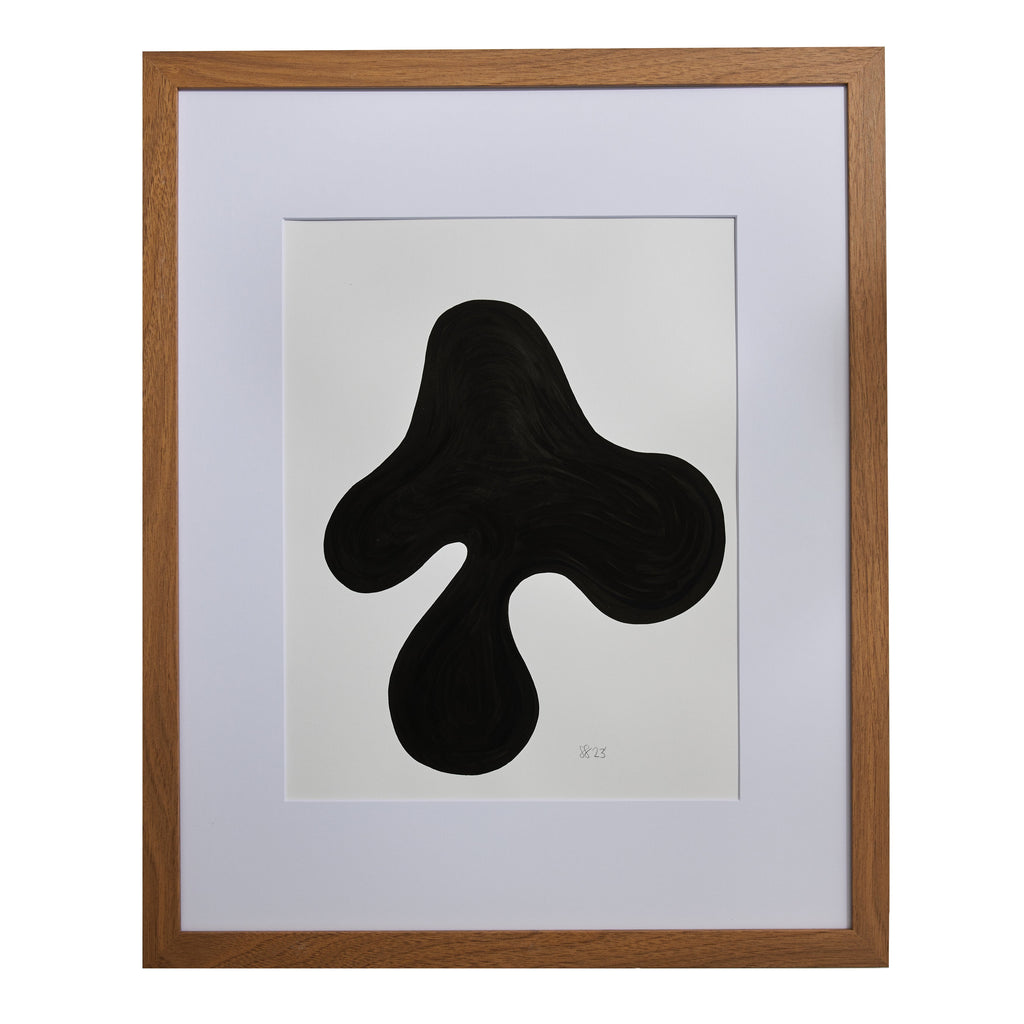The artwork 'Morning Meditation VI' by Shadia Sabagh features a bold, abstract black organic shape against a white background. The form resembles a fluid, three-pronged silhouette, creating a striking minimalist composition. Presented in a wooden frame with white matting, this acrylic marker piece exemplifies contemporary abstract expressionism.