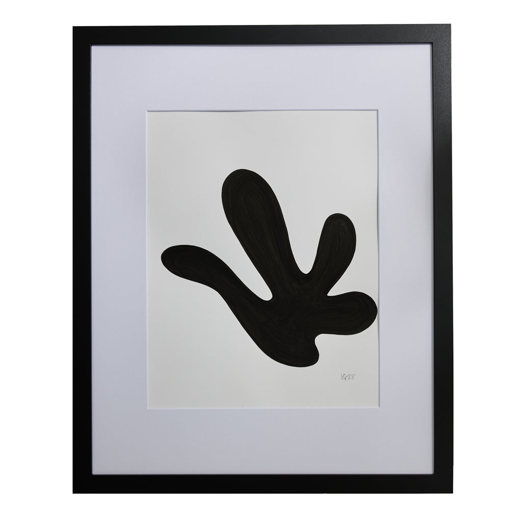 The artwork 'Morning Meditation XIII' by Shadia Sabagh features a bold black organic shape resembling a fluid hand or abstract leaf silhouette against a crisp white background, framed in black. Created with acrylic marker on mixed media paper, the minimalist composition explores negative space and organic forms with a modern, zen-like aesthetic.