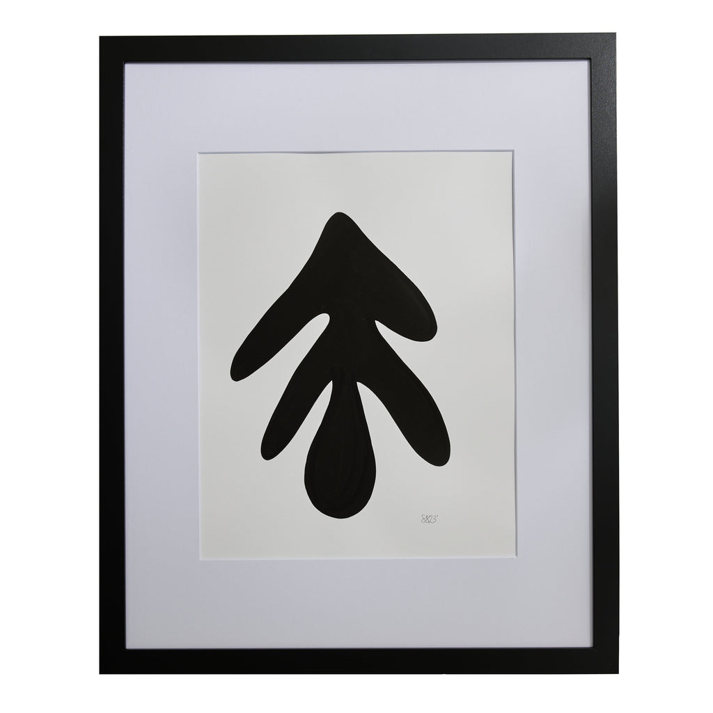 The artwork 'Morning Meditation XIV' by Shadia Sabagh features a bold black abstract shape on white paper, resembling a minimalist leaf or droplet form. The striking silhouette, created with acrylic marker, is displayed in a black frame with white matting, creating a strong monochromatic contrast. The composition embodies zen-like simplicity and modern design sensibilities.