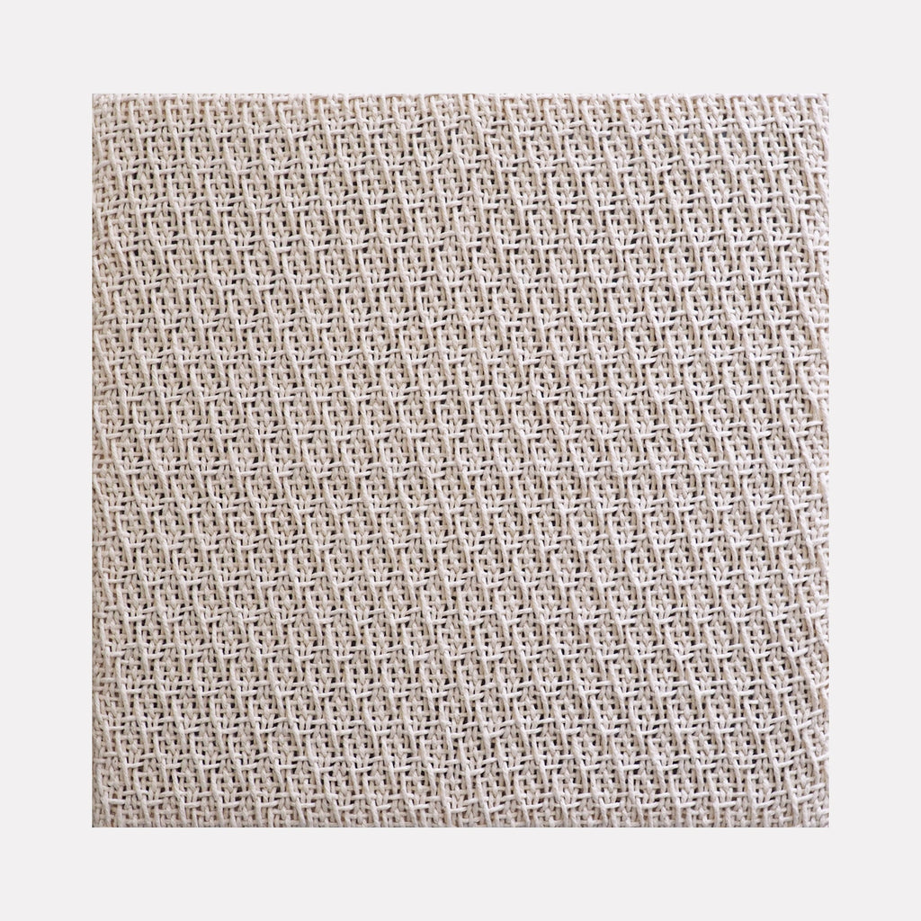 The artwork 'Magnify III' by Morgan Hale features an intricate handwoven cotton textile displaying a mesmerizing repetitive geometric pattern in soft cream tones. The 24x24 inch piece showcases a delicate lattice-like weave structure with subtle texture variations, creating a sophisticated minimalist design that emphasizes craftsmanship and natural materials.