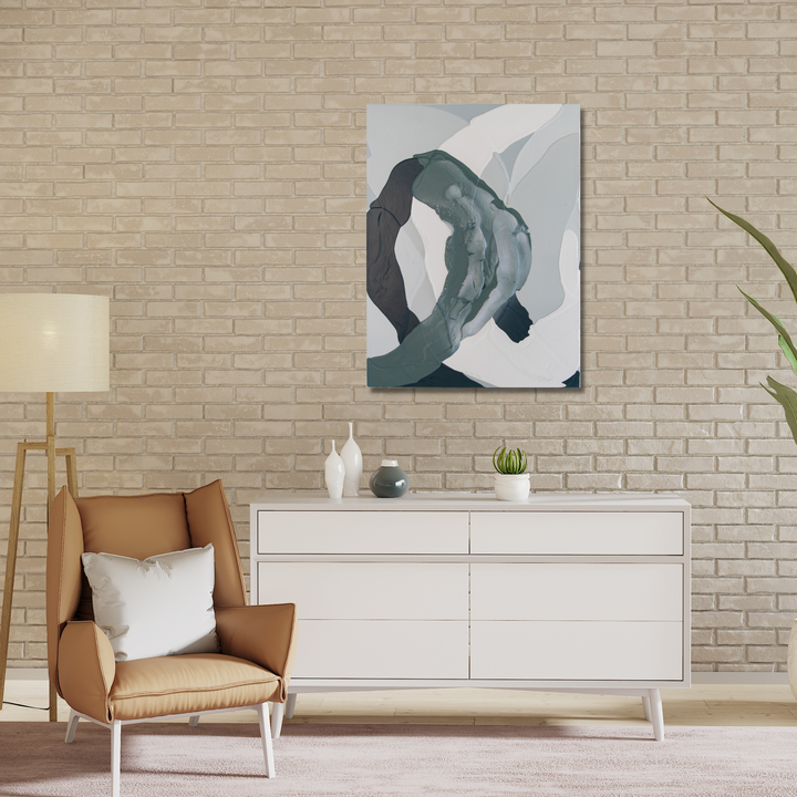 The artwork 'Meditation in Grey Green II' features fluid, abstract brushstrokes in muted sage green and light grey tones, creating a harmonious organic composition against a white background. The modern minimalist painting displays sweeping curved forms that intertwine, executed in latex and spray paint on wood panel. By Renee Phillips.