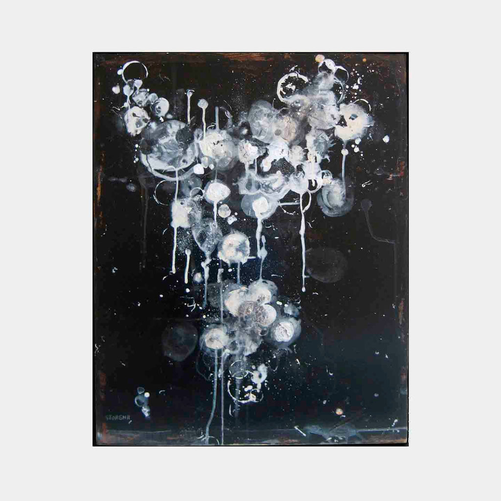 The artwork 'Midnight One' by Shira Toren features ethereal white and gray circular forms floating against a deep black background. Abstract drips and splatters create a celestial effect, with translucent orbs cascading downward like cosmic bubbles. Painted in acrylic on canvas, the piece combines fluid techniques with controlled dripping effects, measuring 30x24 inches.