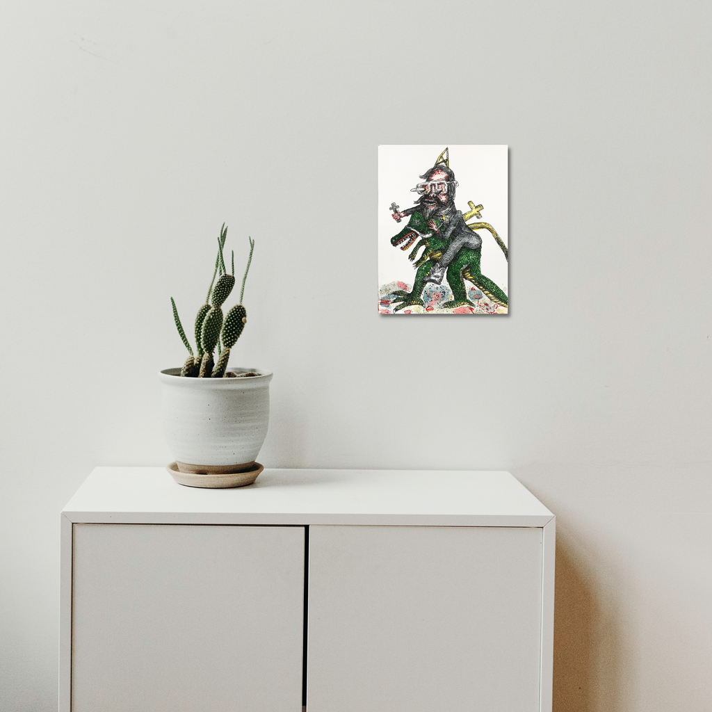 The artwork 'Missionary Dinosaur' by Andrew Chan features a whimsical watercolor and ink illustration of a green dinosaur wearing missionary attire including a black suit and tie. The detailed artwork showcases delicate brushstrokes, vibrant green tones, and expressive linework, displayed above a white cabinet with a potted cactus plant.