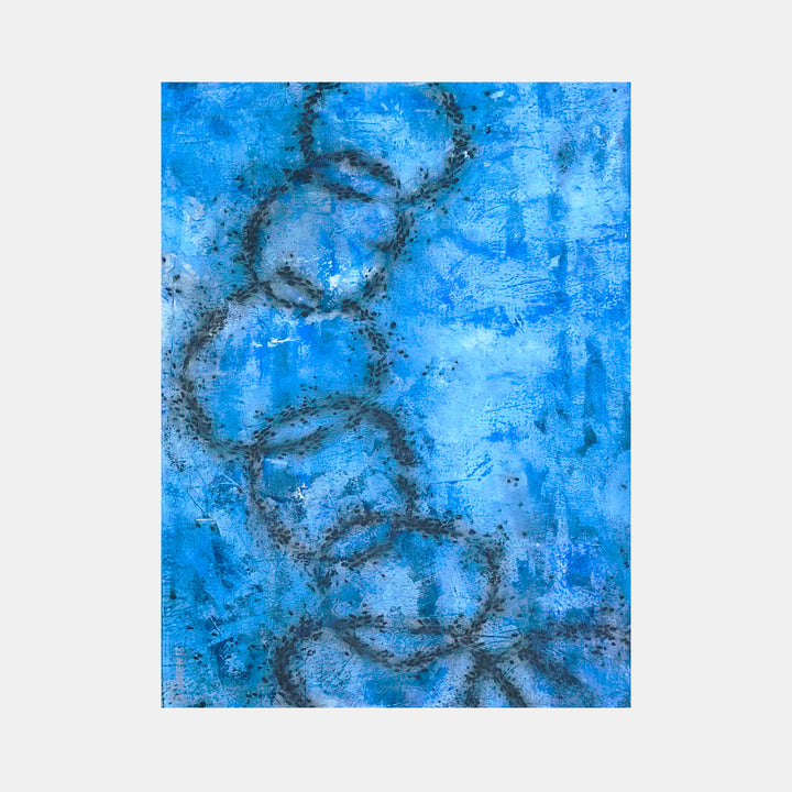 The artwork 'Moving Parts' features a dynamic composition of intertwining curved lines in deep charcoal against a vibrant azure blue background. Created with Venetian plaster and pigment, the textured surface reveals subtle variations in the blue tones, while the flowing circular forms suggest continuous movement and rhythm across the 40x30 inch canvas. By Shira Toren.
