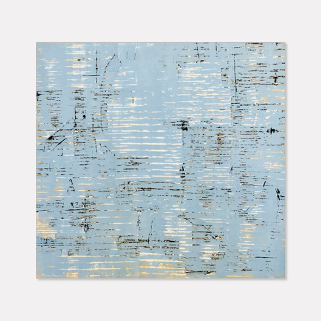 The artwork 'Ocean' by Shira Toren features horizontal textured lines against a serene light blue background, creating a rippling water effect. Delicate black marks and cream-colored accents scatter across the canvas, suggesting reflections on water. Created with Venetian plaster pigment, the abstract composition evokes a tranquil seascape with its layered, weathered surface.