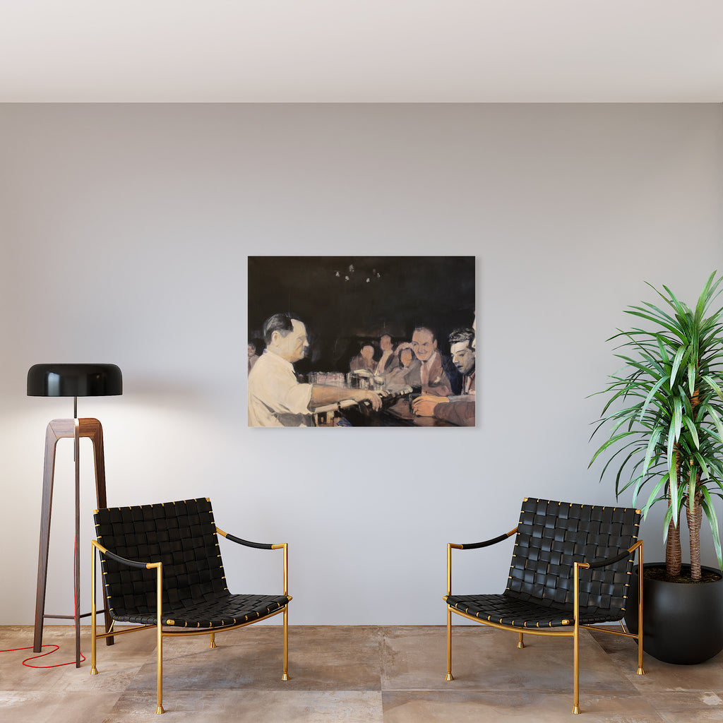 The artwork 'One More' by Chris Baily features a vintage sepia-toned photograph displayed on a modern interior wall, flanked by two elegant black woven leather chairs with gold frames. The contemporary room setting includes a sleek floor lamp and potted palm, creating a striking contrast between historical and modern elements. Acrylic on canvas, 36x48 inches by Chris Baily.