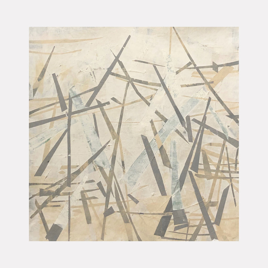 The artwork 'Pale Out' by Shira Toren features intersecting geometric lines in muted gray and brown tones against a creamy beige background. Abstract angular strokes create a dynamic composition reminiscent of scattered matchsticks or fallen branches. The 24x24 inch print employs a minimalist aesthetic with layered translucent elements creating depth and movement.