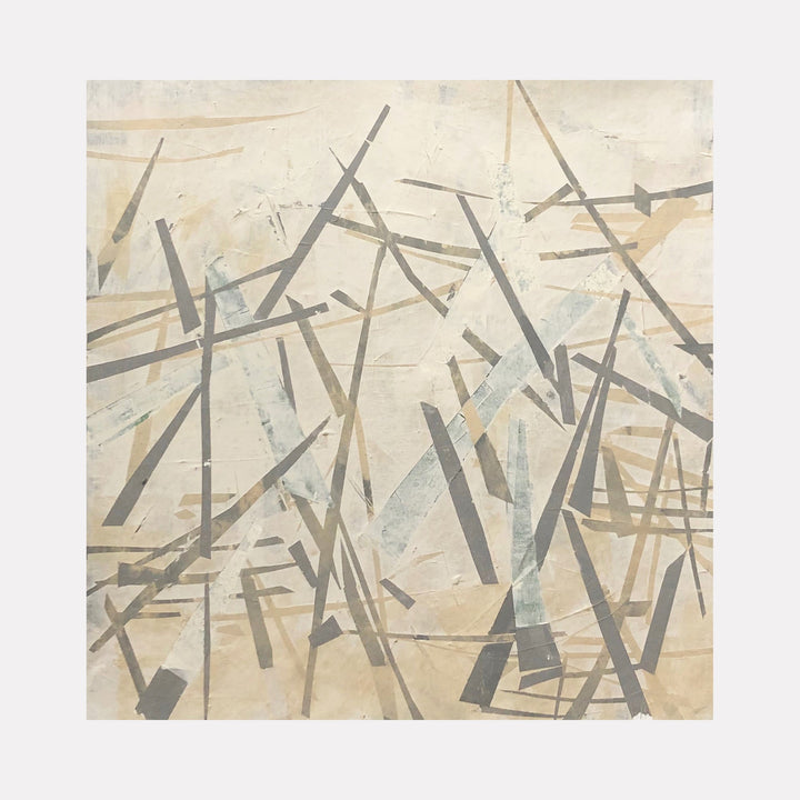 The artwork 'Pale Out' by Shira Toren features intersecting geometric lines in muted gray and brown tones against a creamy beige background. Abstract angular strokes create a dynamic composition reminiscent of scattered matchsticks or fallen branches. The 24x24 inch print employs a minimalist aesthetic with layered translucent elements creating depth and movement.