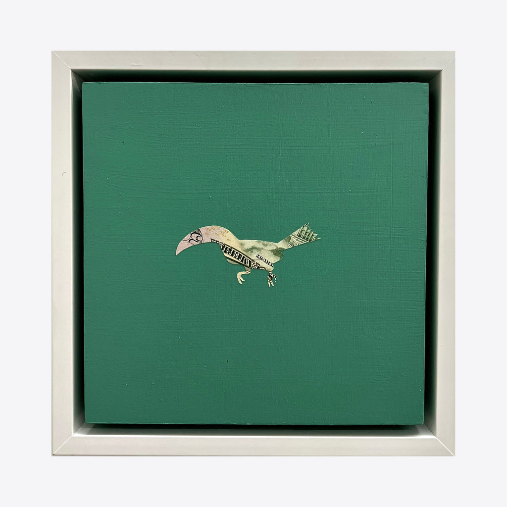 The artwork 'Profit Margins, Toucan' by Jacki Davis features a minimalist toucan bird crafted from folded US currency against a solid emerald green background. The mixed media piece, set in a white frame, combines paper currency art with acrylic on an 8x8 inch wood panel, creating a striking contrast between the financial medium and natural form.