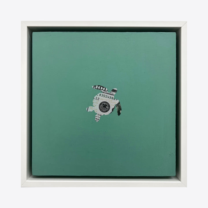Spirit Messengers, Sea Turtle by Jacki Davis features a minimalist collage on a seafoam green background. The artwork incorporates deconstructed US currency pieces arranged to form a small, abstract turtle shape in silvery-gray tones, set against an 8x8 inch wood panel with acrylic finish, showcasing a unique mixed-media approach. By Jacki Davis.