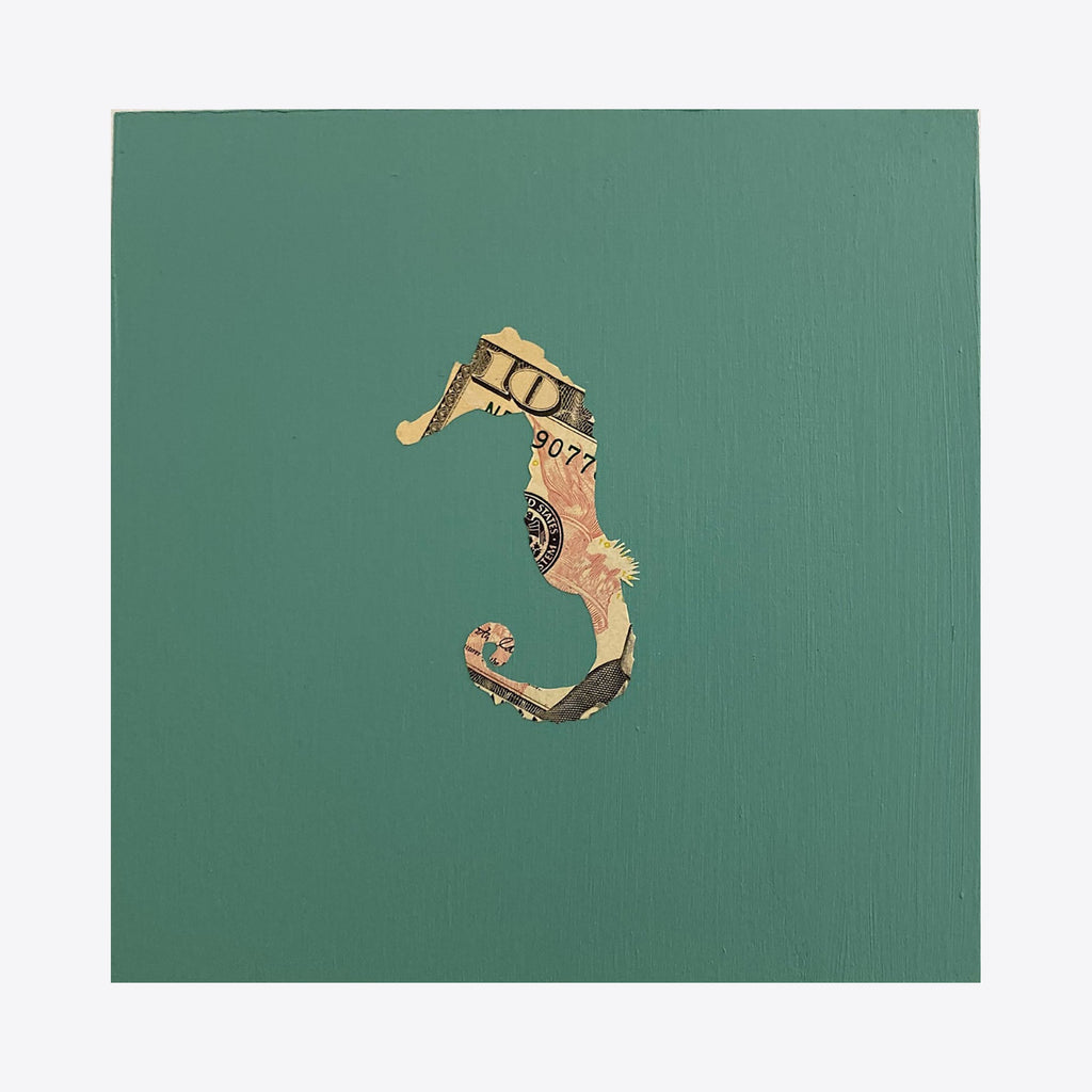 The artwork 'Spirit Messengers, Seahorse' by Jacki Davis features a whimsical seahorse crafted from US currency against a rich teal-green wooden panel. The seahorse shape is intricately cut from dollar bills, showcasing the currency's unique patterns and details, creating a striking contrast against the solid background. Mixed media artwork, 8x8 inches by Jacki Davis.