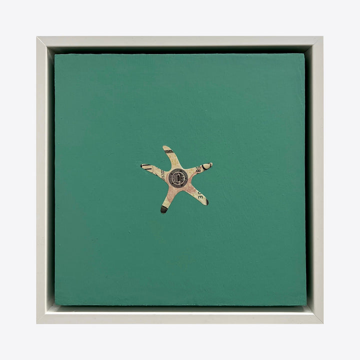 Spirit Messengers, Starfish by Jacki Davis features a minimalist starfish shape crafted from US currency on a solid seafoam green background. The mixed media artwork, set in a light gray frame, combines paper currency and acrylic on wood panel, creating a striking contrast between the metallic dollar bill texture and smooth painted surface.