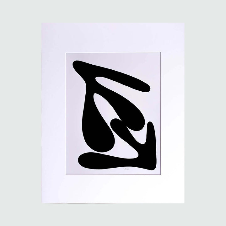 The artwork 'The Morning Meditation Series 2' by Shadia Sabagh features a bold black abstract shape on white background, reminiscent of modern calligraphy. The freehand drawing showcases fluid, organic curves forming an interconnected design that suggests movement and balance. The stark monochromatic limited edition print measures 20x16 inches.