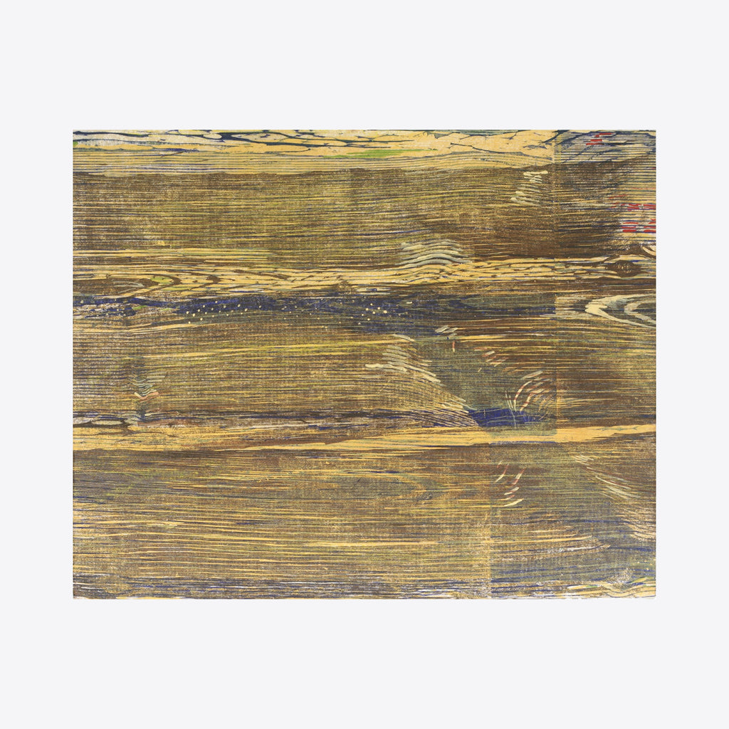 The artwork 'Floating Core' by Emna Zghal features abstract horizontal layers of woodcut prints in earthy gold and deep charcoal tones. The textured composition reveals natural wood grain patterns and organic striations, creating a contemplative landscape-like effect mounted on canvas. The 16x20 inch piece demonstrates masterful woodblock printing technique with subtle color variations and rustic textures.