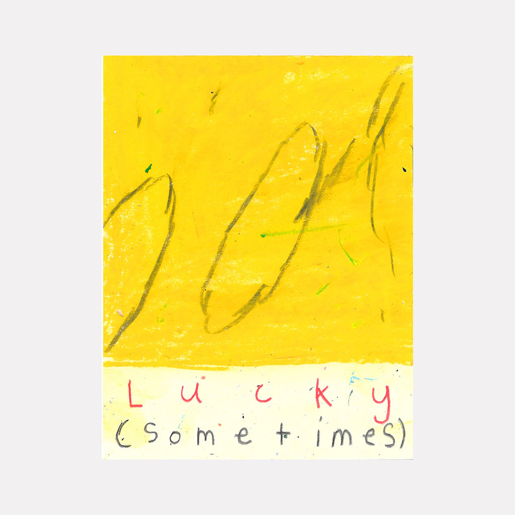 The artwork 'Lucky Sometimes' by Joseph O'Neal features abstract gestural marks in gray pencil strokes against a vibrant yellow background, with the title handwritten in mixed red and gray letters below. The piece combines loose, flowing lines with minimalist text on paper using pencil and wax pastel. By Joseph O'Neal.