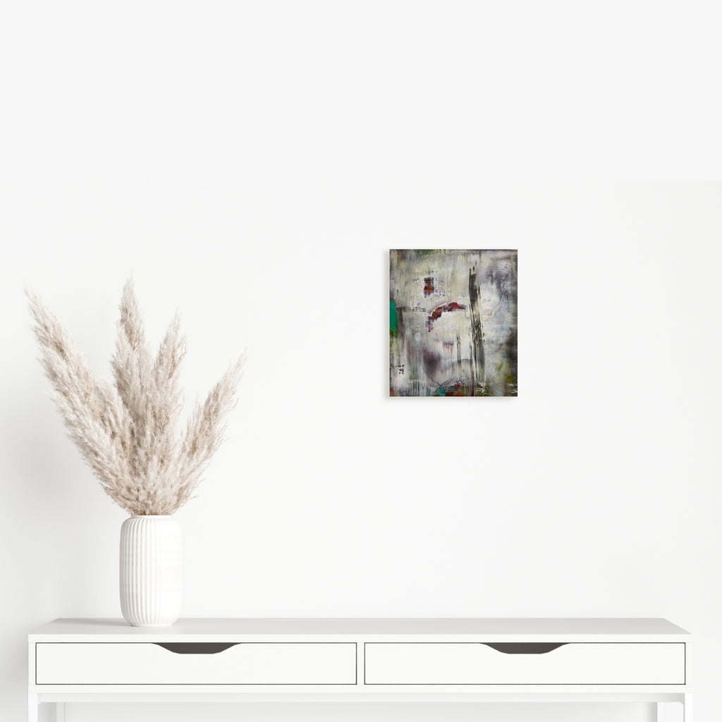 The artwork 'Plunge' by Barbara Groh features an abstract composition with textural layers of grey and white, accented by subtle touches of emerald green and deep burgundy. The oil and cold wax medium creates a weathered, atmospheric effect with vertical elements suggesting architectural forms or natural landscapes emerging through misty depths by Barbara Groh.