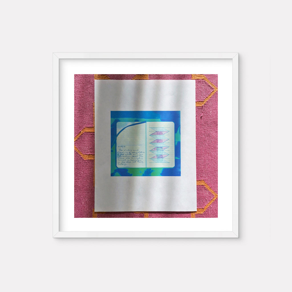 The artwork 'Re-Creating Herself' by Anne Sherwood Pundyk features a digital inkjet print displaying handwritten text on an open book-like form against a vibrant turquoise blue background. The piece is presented in a white frame against a textured pink fabric with geometric orange patterns. A metallic silver mat adds depth and contrast to the 13x13 inch composition. By Anne Sherwood Pundyk.