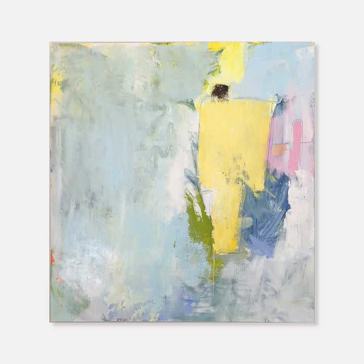 The artwork 'I Never Said It Would Be Easy #2' by Petra Nimtz features an abstract composition with a dominant yellow rectangular form against a soft blue-grey background. Gentle brushstrokes create textural interest while touches of pink, green, and navy blue add depth to the minimalist oil painting on linen canvas. The ethereal quality suggests movement and emotional expression through color.
