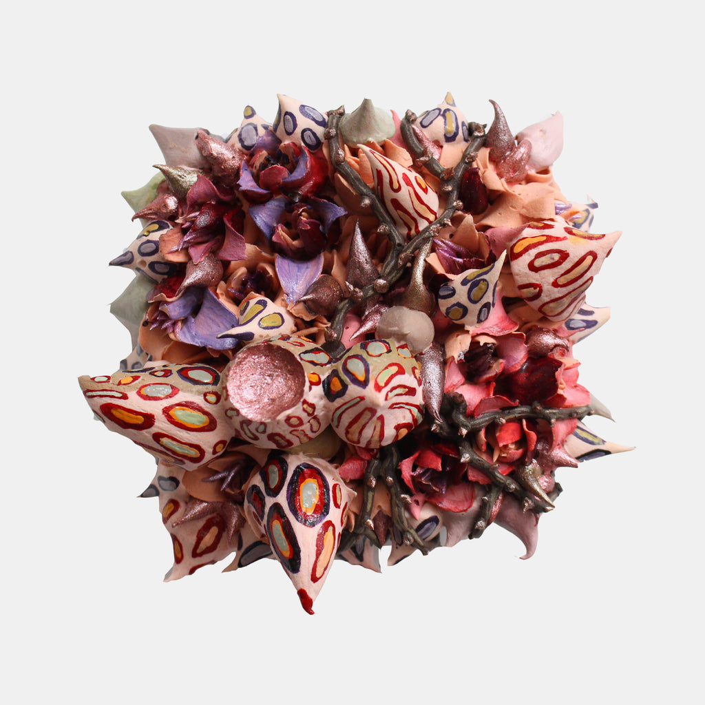The artwork 'Pandora' by Seren Morey features a vibrant sculptural composition of coral-like forms in pink, red, and purple hues. The ultralight acrylic piece displays intricate organic patterns with circular motifs and spiky protrusions, creating a dynamic three-dimensional effect against a white background. The 6.5-inch square panel showcases textural elements and flowing forms reminiscent of marine life by Seren Morey.