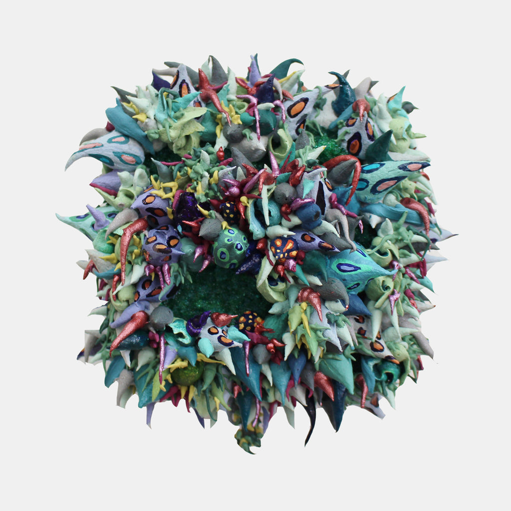 The artwork 'Plexaurella' by Seren Morey features an intricate coral-like formation in vibrant aquatic colors, combining turquoise, mint green, and deep purple hues. The sculptural piece showcases dynamic, organic shapes with spiky protrusions and swirling textures, created using ultralight acrylic, pigment dispersions, and glass beads on panel, measuring 7 x 6.5 inches.