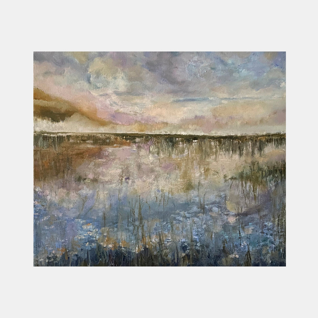 The artwork 'Reflection III' by Rita BasuMallick depicts a serene wetland landscape at dusk, featuring muted earth tones and reflective waters. The oil painting showcases a dramatic cloudy sky in peach and grey hues, mirrored in the tranquil marsh below, with delicate reed-like vegetation creating texture in deep blues and browns across the 28x24 inch canvas.