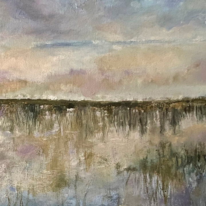 The artwork 'Reflection III' by Rita BasuMallick captures a serene wetland landscape in oil on canvas, featuring muted earth tones and soft pastels. A misty horizon line divides the composition between a textured sky and its mirror image in still waters, with delicate brushstrokes creating a dreamy, atmospheric effect through layers of beige, gray, and lavender hues.