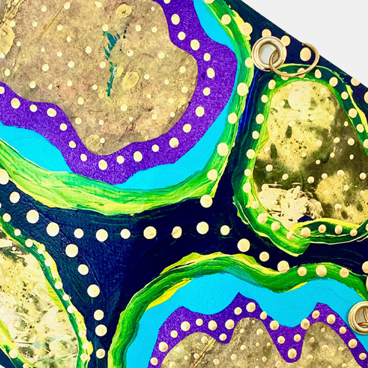 The artwork 'Remembrance 4' by Sunny Chapman features abstract organic shapes in metallic gold, bordered by vibrant turquoise and purple paths decorated with white dotted patterns. The composition includes bold green accents and deep navy backgrounds, creating a dynamic flow of curved elements reminiscent of aerial topography or cellular structures. Acrylic on paper, 16x12 inches, by Sunny Chapman.