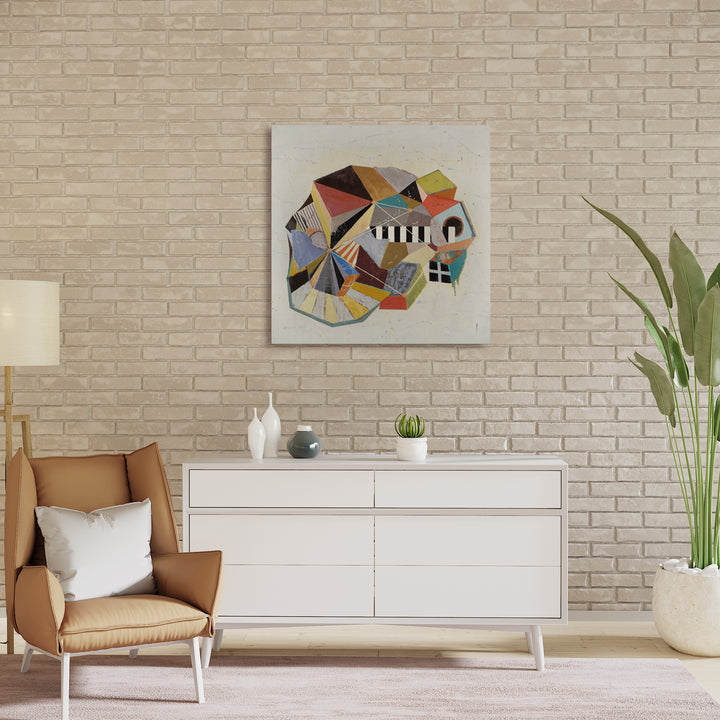 The artwork 'Retreat' by Karen Nielsen-Fried features an abstract geometric composition with intersecting angular shapes in warm peach, yellow, black, and gray tones. The circular arrangement creates a dynamic movement across the white surface, rendered in encaustic and oil on wood panel, measuring 36x36 inches.
