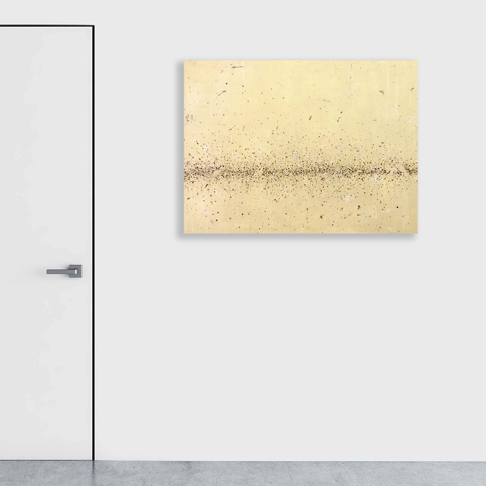 The artwork 'Rice' by Shira Toren features a minimalist horizontal composition in warm cream tones with scattered dark speckles creating a delicate linear pattern across the center. Created with Venetian plaster and graphite on canvas, the texture evokes scattered rice grains against a serene backdrop, measuring 36 x 48 inches by Shira Toren.