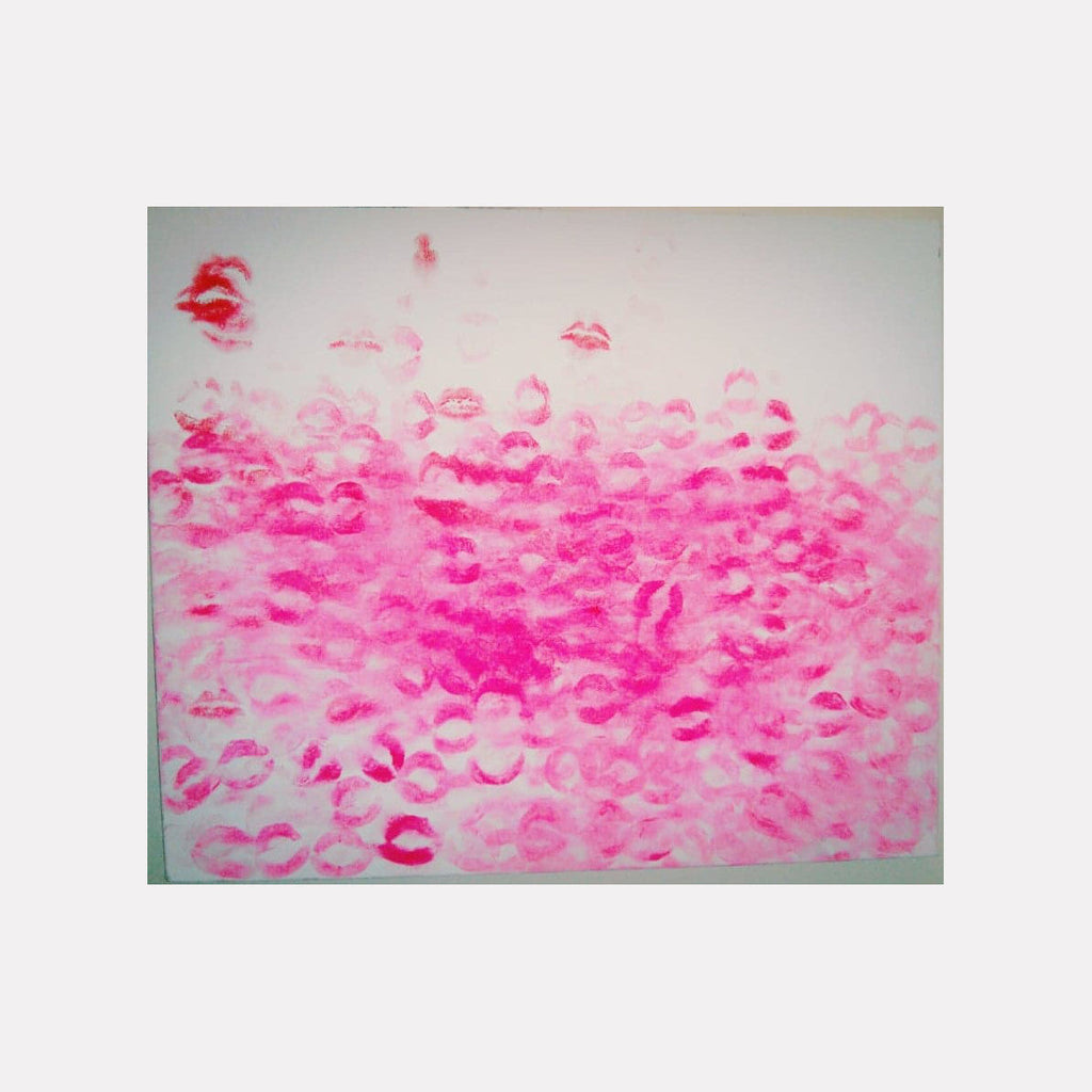 The artwork 'Kisses' by Ronit Levin Delgado features multiple pink lipstick impressions scattered across a white canvas, creating a dynamic pattern of lip marks in varying shades of pink, from light rose to vibrant magenta. The prints appear to float and cluster together, forming an abstract composition measuring 16x24 inches.