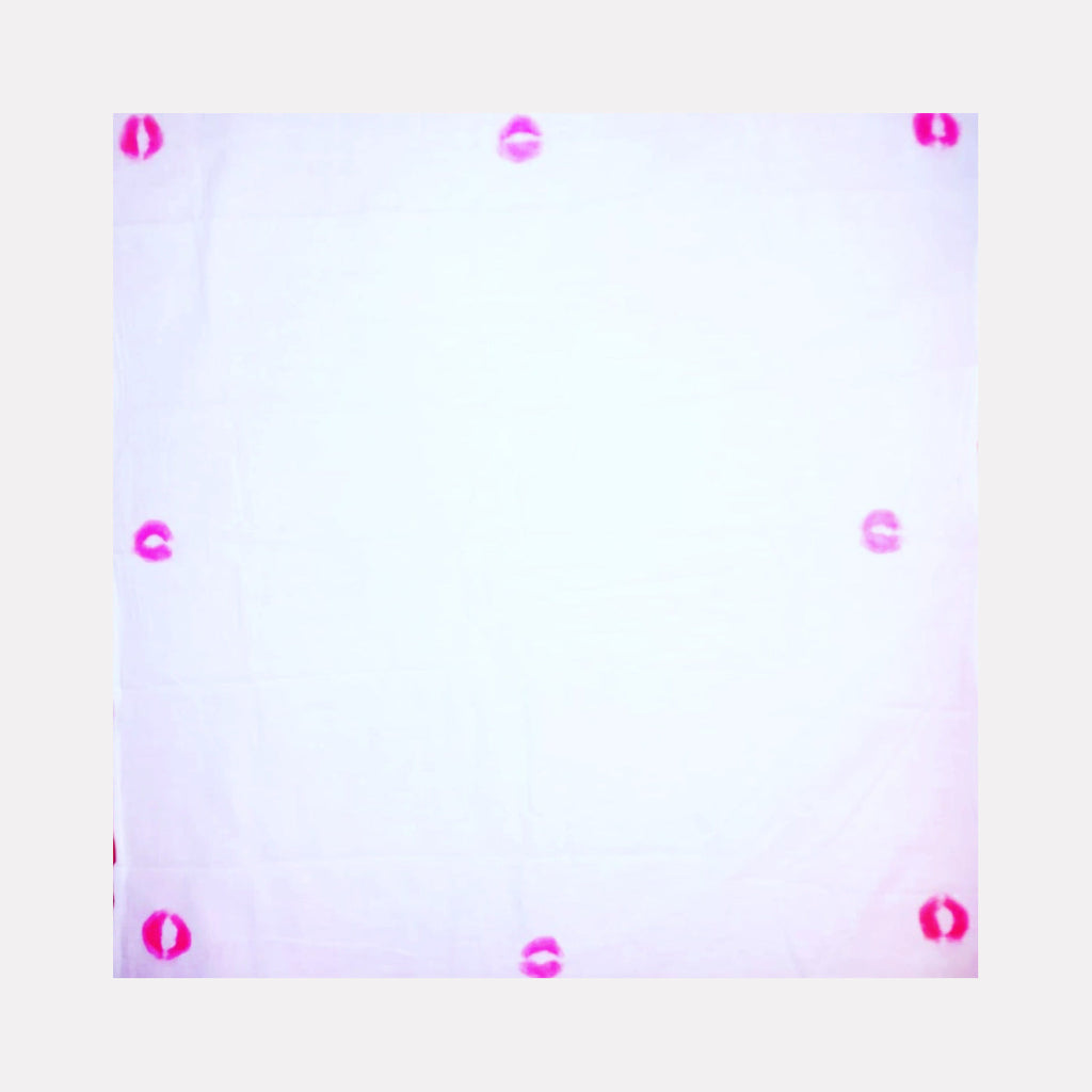 The artwork 'Sealed with a Kiss 4' by Ronit Levin Delgado features eight vibrant pink lipstick marks arranged symmetrically around the edges of a pristine white 10x10 canvas, creating a minimalist frame effect. Each kiss mark appears crisp and distinct against the clean background, embodying both performance art and traditional painting techniques.