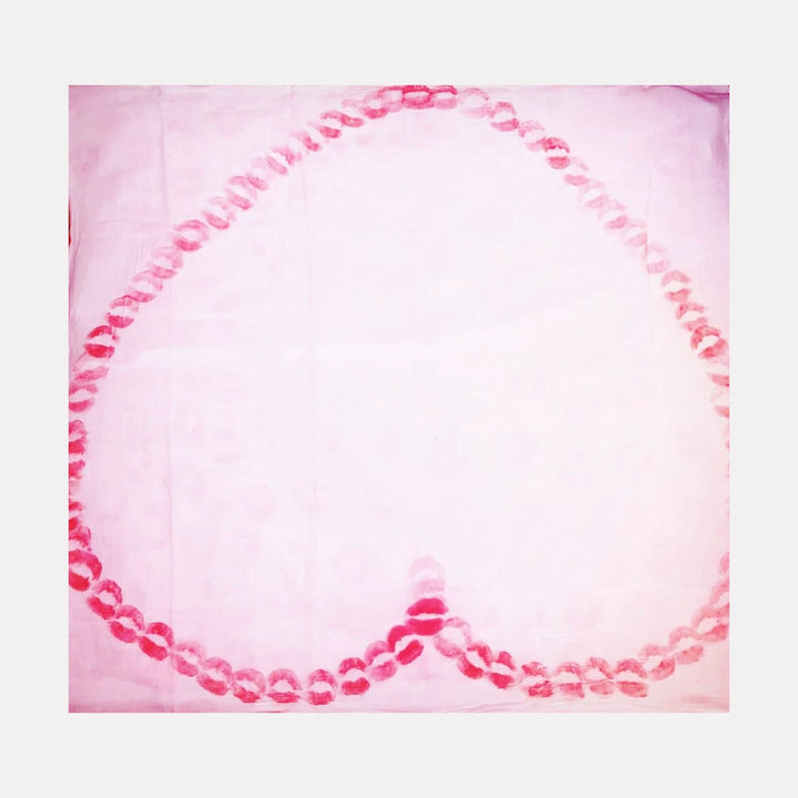 The artwork 'Sealed with a kiss 5' by Ronit Levin Delgado features a large heart shape created from vibrant red lipstick marks on a soft pink canvas. Each kiss mark forms a continuous pattern, creating a delicate yet bold outline against the pastel background, showcasing unique texture and intimate artistic expression.