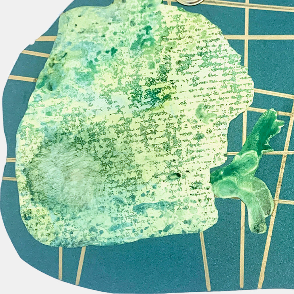 The artwork 'I Am Talking, Cat' by Sunny Chapman features a textured green silhouette of a cat's head against a deep teal background with gold geometric grid lines. The cat profile is created using metallic paper and monotype printing techniques, showing varied shades of mint and emerald with a distinctive textural pattern. A stylized flower or leaf form extends from the composition.