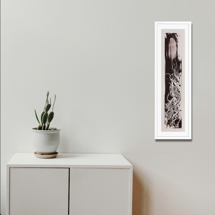The artwork 'Serpentine' by Barbara Groh features a striking vertical etching with intricate swirling patterns in black and white. The elongated composition showcases fluid, snake-like forms interweaving through abstract textures and organic shapes, creating a dynamic flow within the narrow 31-inch frame. The etching technique produces delicate lines and rich contrasts.