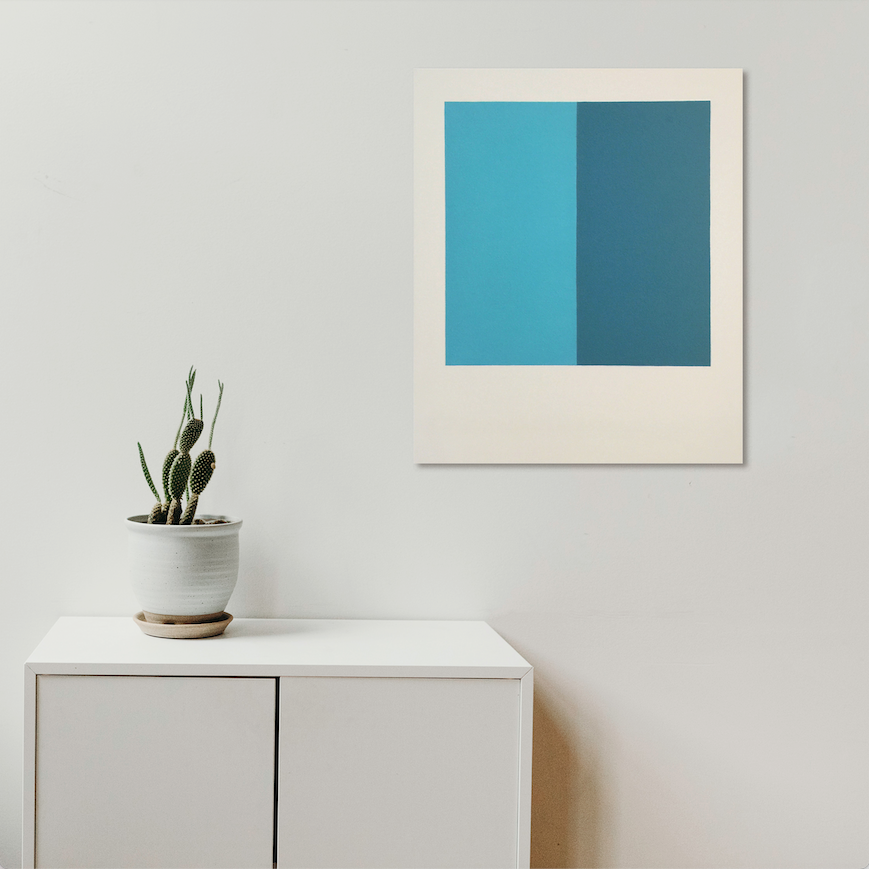 The artwork 'Recovery (Diptych)' by Shyun Song features a minimalist abstract composition with two vertical panels in contrasting shades of turquoise and deep teal blue, set against a white background. The oil on canvas piece creates a serene color block effect, mounted above a modern white cabinet with a small potted cactus.