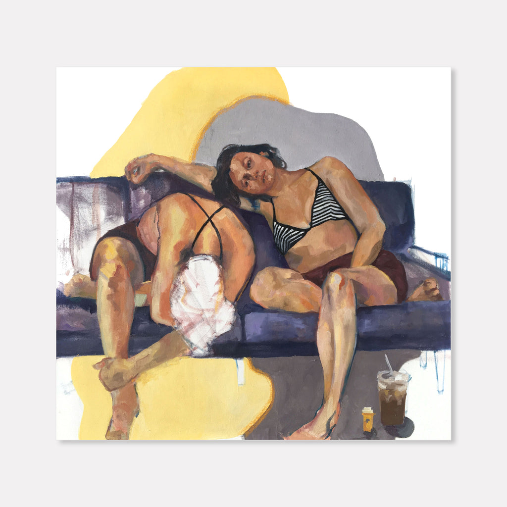 The artwork 'Self Soothing' features figures reclining on a dark blue couch against a backdrop of warm yellow and cool gray shapes. The oil painting depicts a relaxed scene with soft brushstrokes creating rich skin tones and gentle shadows. A glass with drink appears in the composition, adding to the casual atmosphere. Original artwork by Hanna Brody.