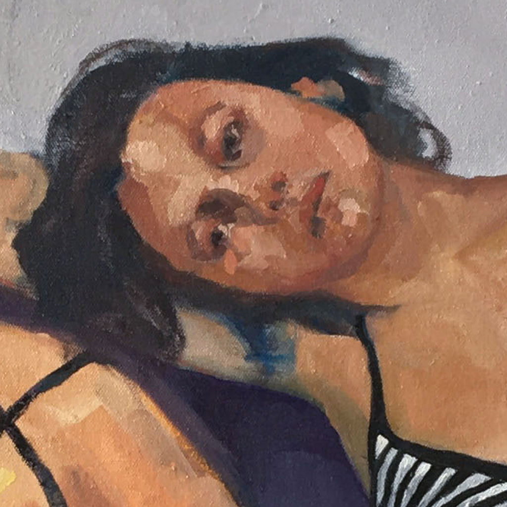 The artwork 'Self Soothing' by Hanna Brody features an expressive oil painting with warm earth tones and deep navy blues. The composition shows a reclining figure against a neutral background, rendered in loose, gestural brushstrokes characteristic of contemporary figurative art. The painting demonstrates masterful use of light and shadow, creating a peaceful, contemplative atmosphere.