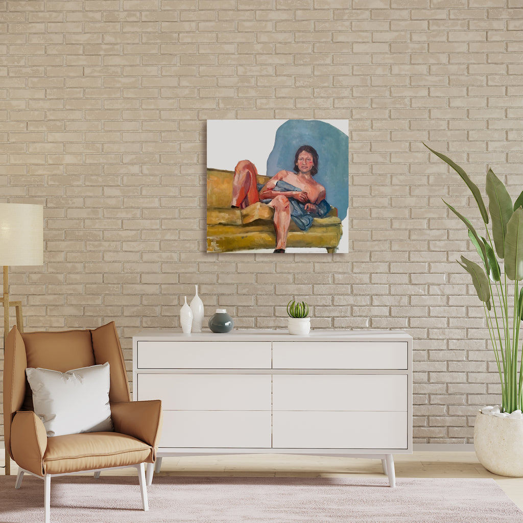 The artwork 'Sleeping on the Couch' depicts a relaxed figure lounging on a mustard yellow couch against a turquoise blue background. The oil painting features loose, expressive brushstrokes creating a casual, intimate atmosphere. The composition balances warm and cool tones in a contemporary style, mounted on a white canvas. Original artwork by Hanna Brody.